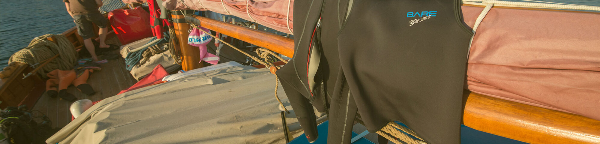 wetsuits on boat
