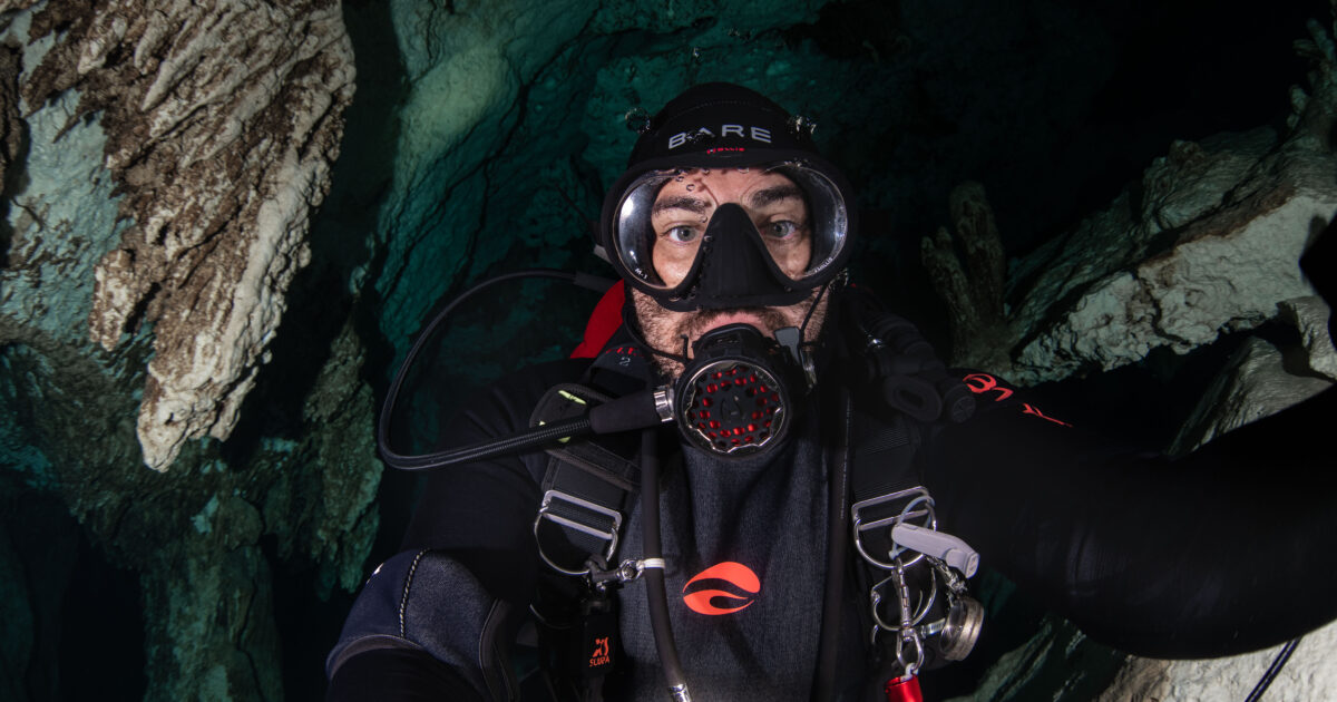 diver in BARE equipment in underwater cave