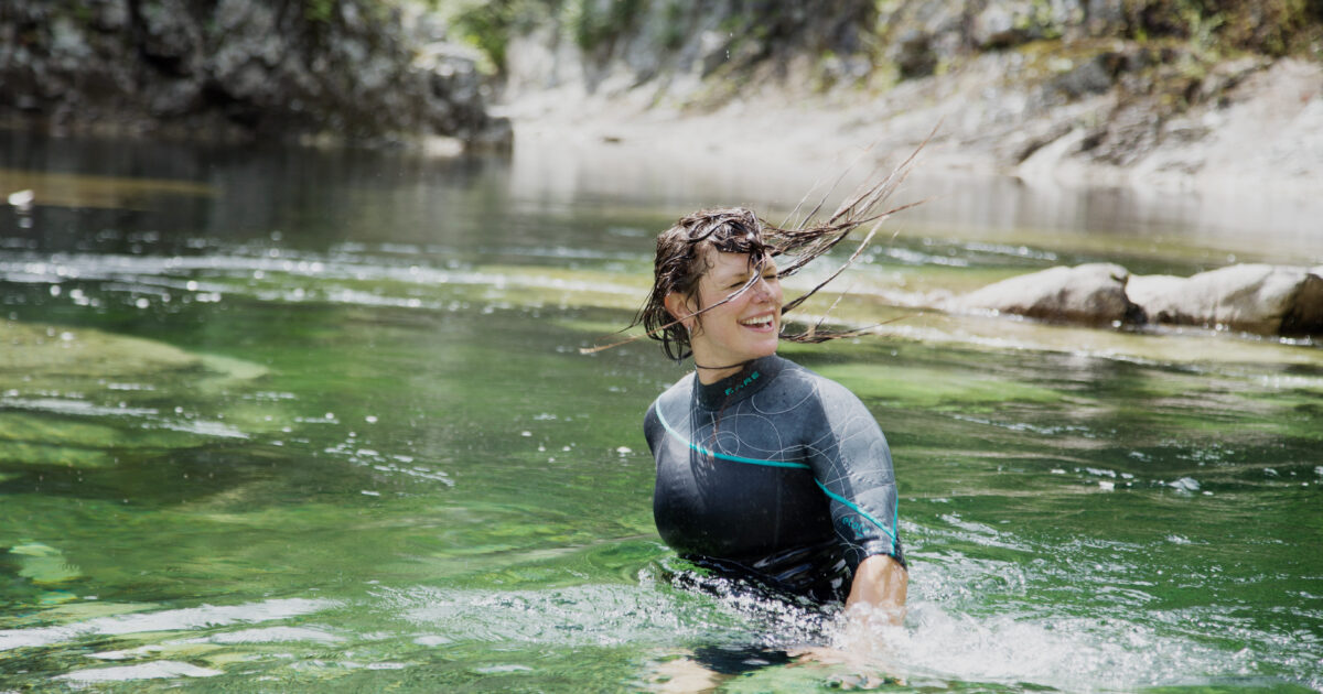 Bare Elate on woman in water