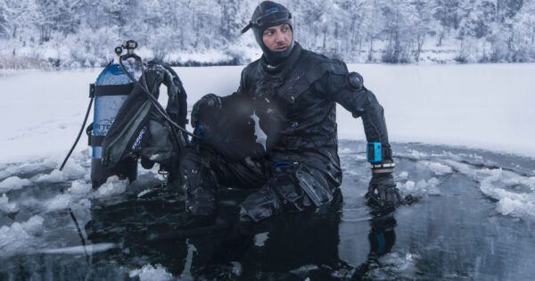 diver coming out of frozen water